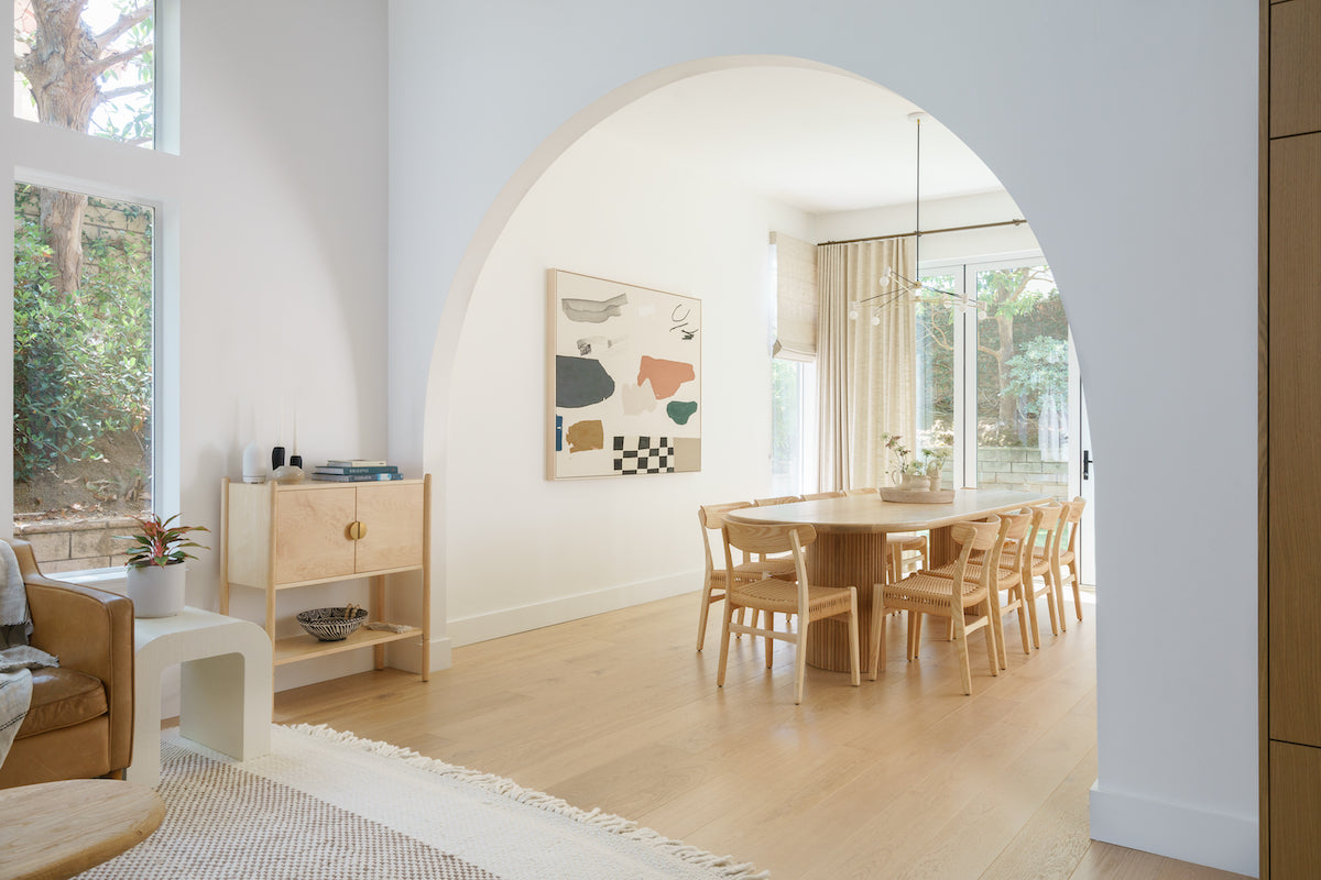 Scandinavian hardwood flooring in a modern living room designed by Natalie Myers