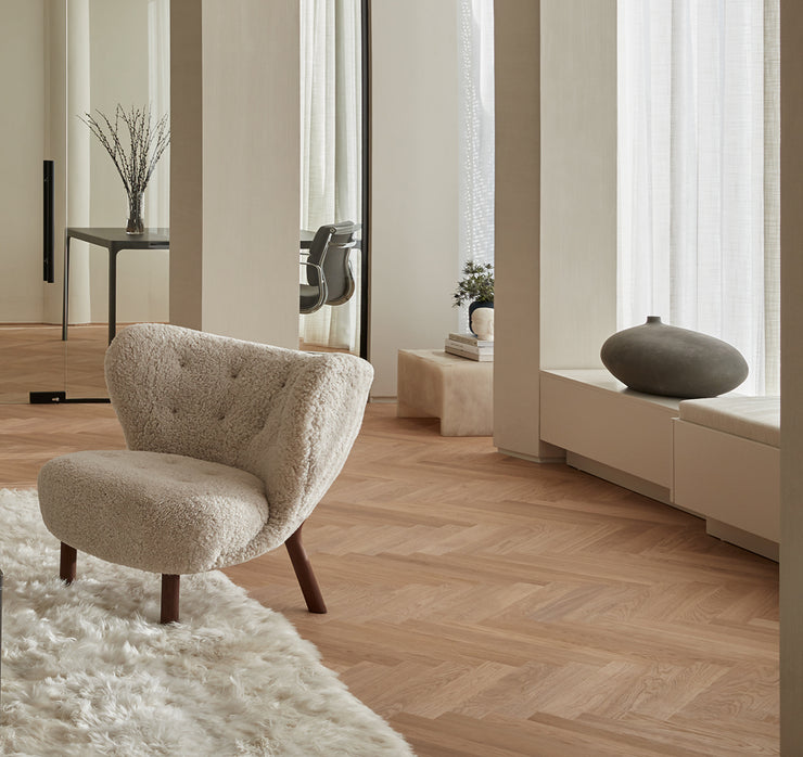 Stuga Sisu herringbone wood flooring in a modern living room