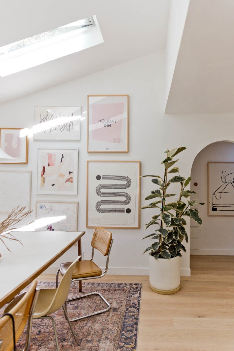 Home renovation inspiration featuring colored area rug on top of Greta wide plank white oak flooring by Stuga