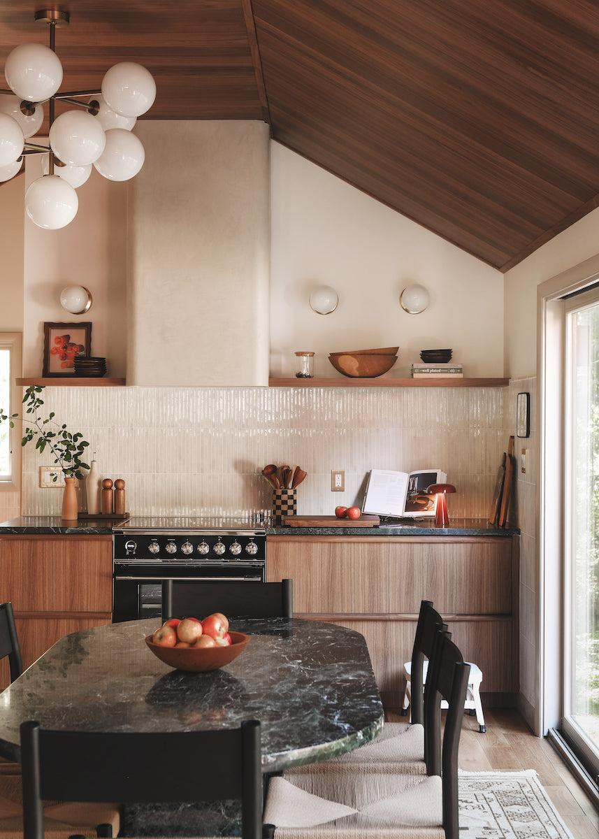 Modern kitchen with walnut flooring on ceilings and walnut cabinets