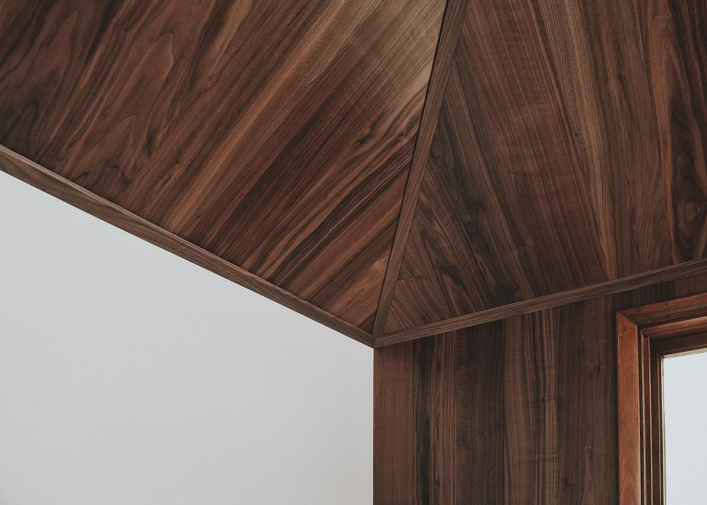 Walnut flooring on walls and ceiling