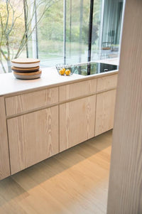 Blonde hardwood flooring in a modern kitchen