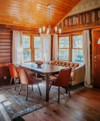 Rustic white oak flooring in a cabin dining area