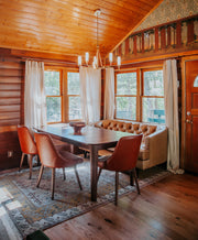 Rustic white oak flooring in a cabin dining area