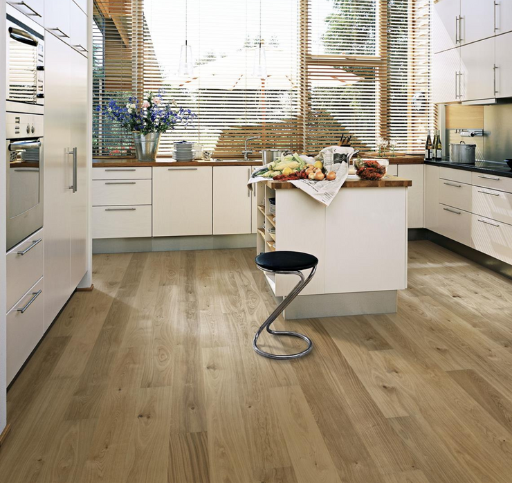 Natural white oak flooring in a modern white kitchen