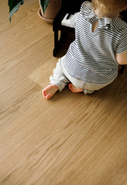 Waterproof wood flooring with a baby playing