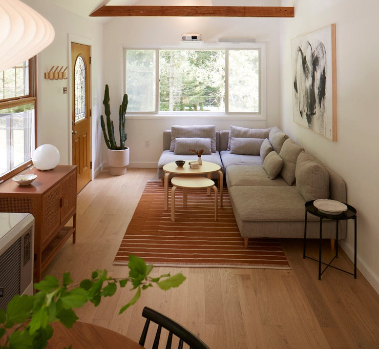 White oak engineered flooring by Stuga in a modern cabin living room