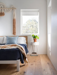 Shell natural white oak flooring by Stuga in a modern bedroom