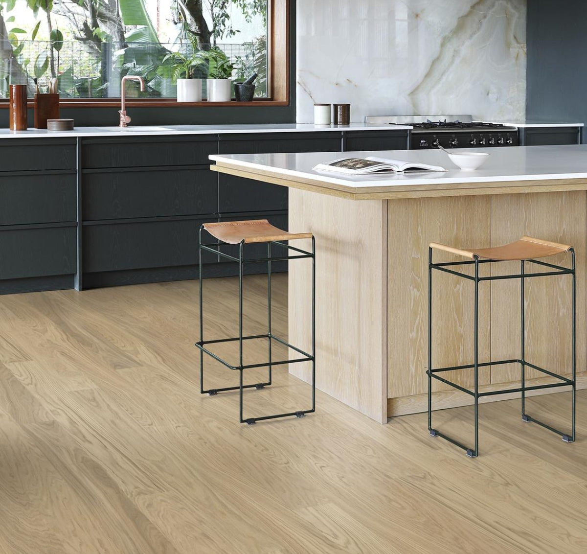 Budget friendly real wood alternative to vinyl. Pop up used in a modern kitchen. Stuga hardwood flooring