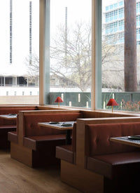 Modern restaurant interior in San Antonio with warm hardwood flooring