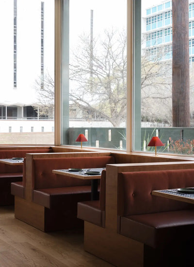 Modern restaurant interior in San Antonio with warm hardwood flooring
