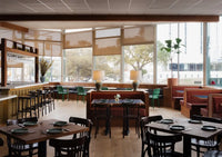 Modern restaurant interior with warm hardwood flooring
