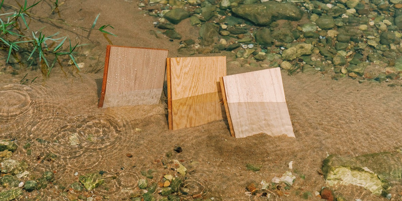 Stuga waterproof wood flooring samples in a river bank