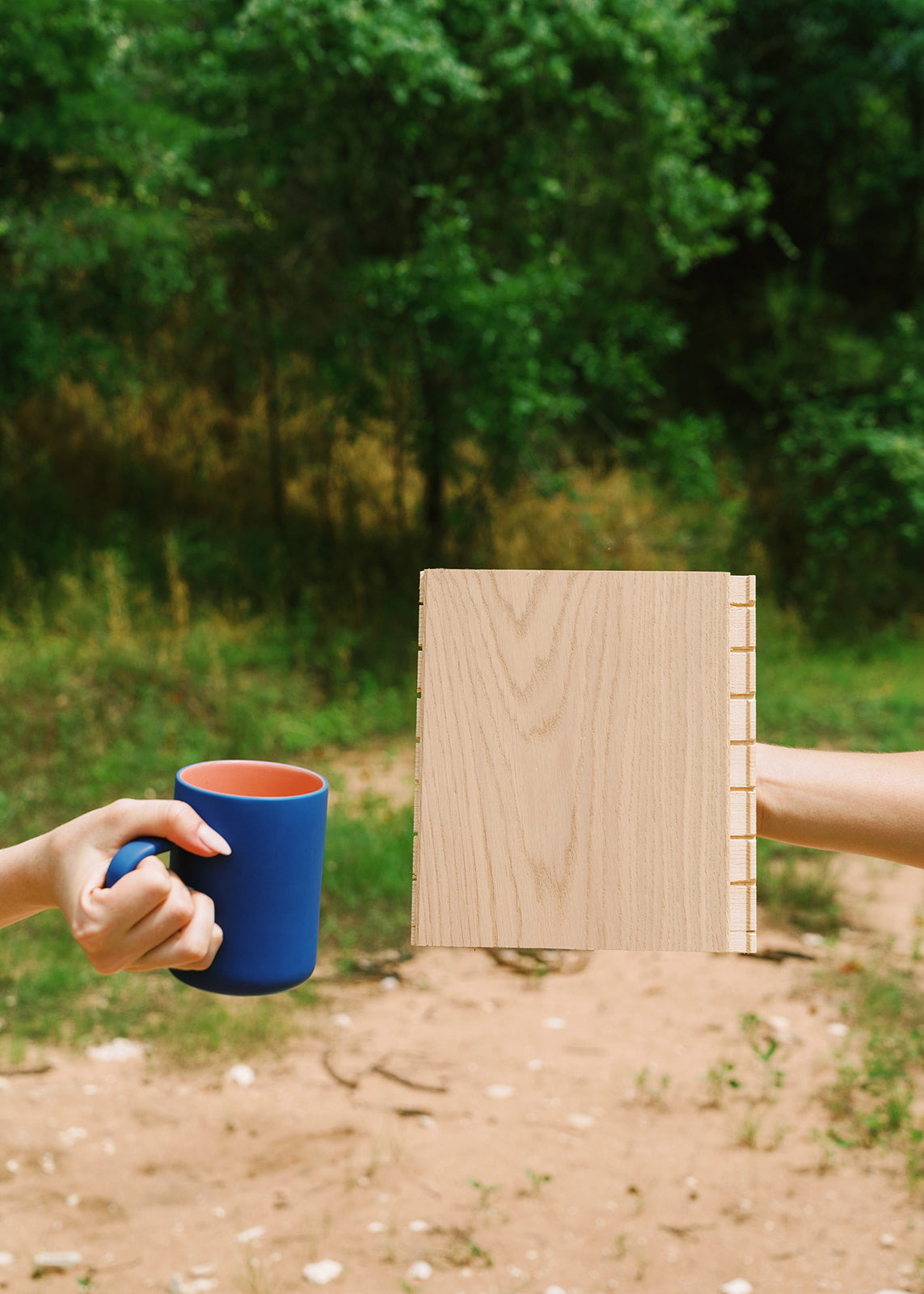 Fika Scandinavian flooring sample with a cup of coffee outdoors