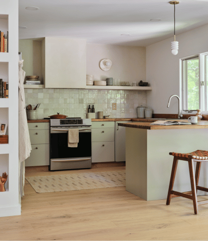 Fika Scandinavian flooring in a modern kitchen with gray cabinets and warm wood counters