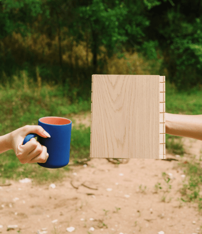 Sample of Fika Scandinavian flooring with a coffee mug in an outdoor setting