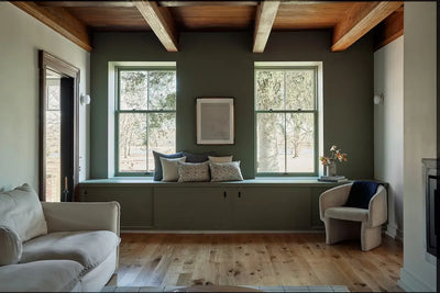 Living room with Forest rustic hardwood flooring by Stuga and moody green paint