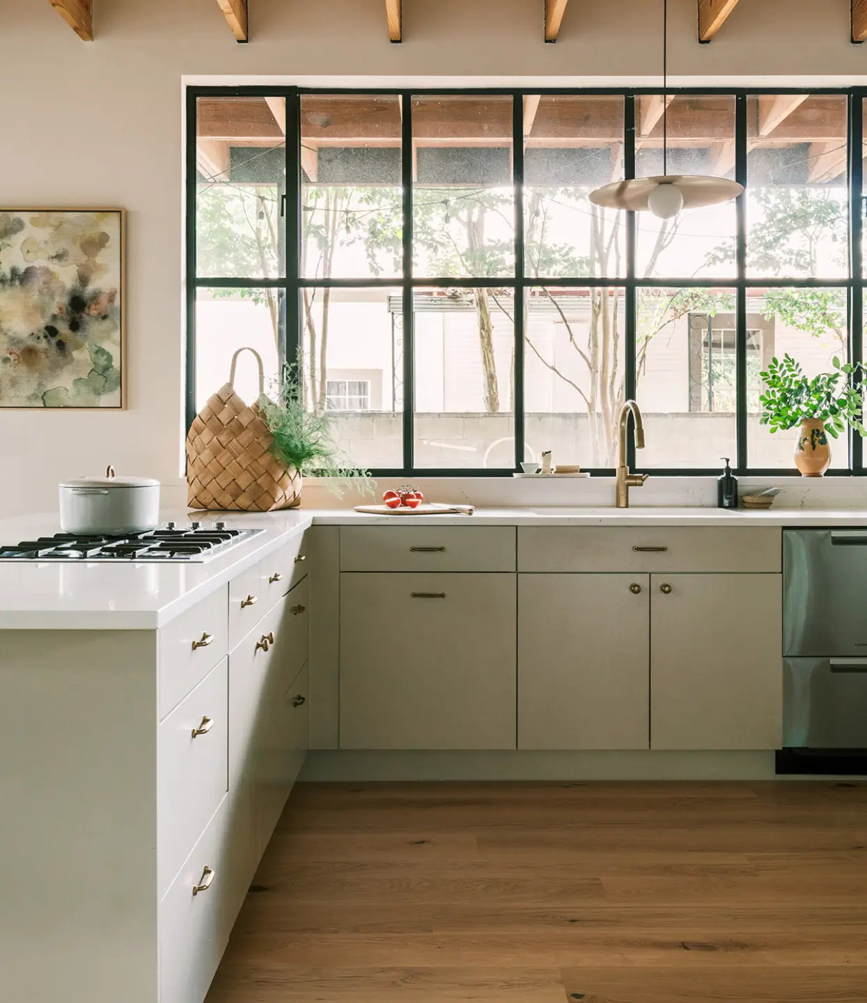 Fredrik neutral white oak flooring in a modern kitchen with light gray cabinets and white counters