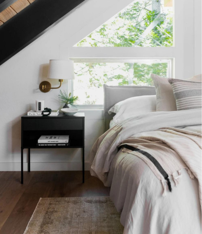 Lake Tahoe cabin bedroom with linen bedding and a hand scraped warm oak floor by Stuga