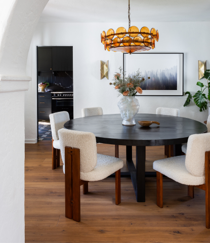 A Spanish Revival dining room with hand scraped oak flooring by Stuga and modern furniture