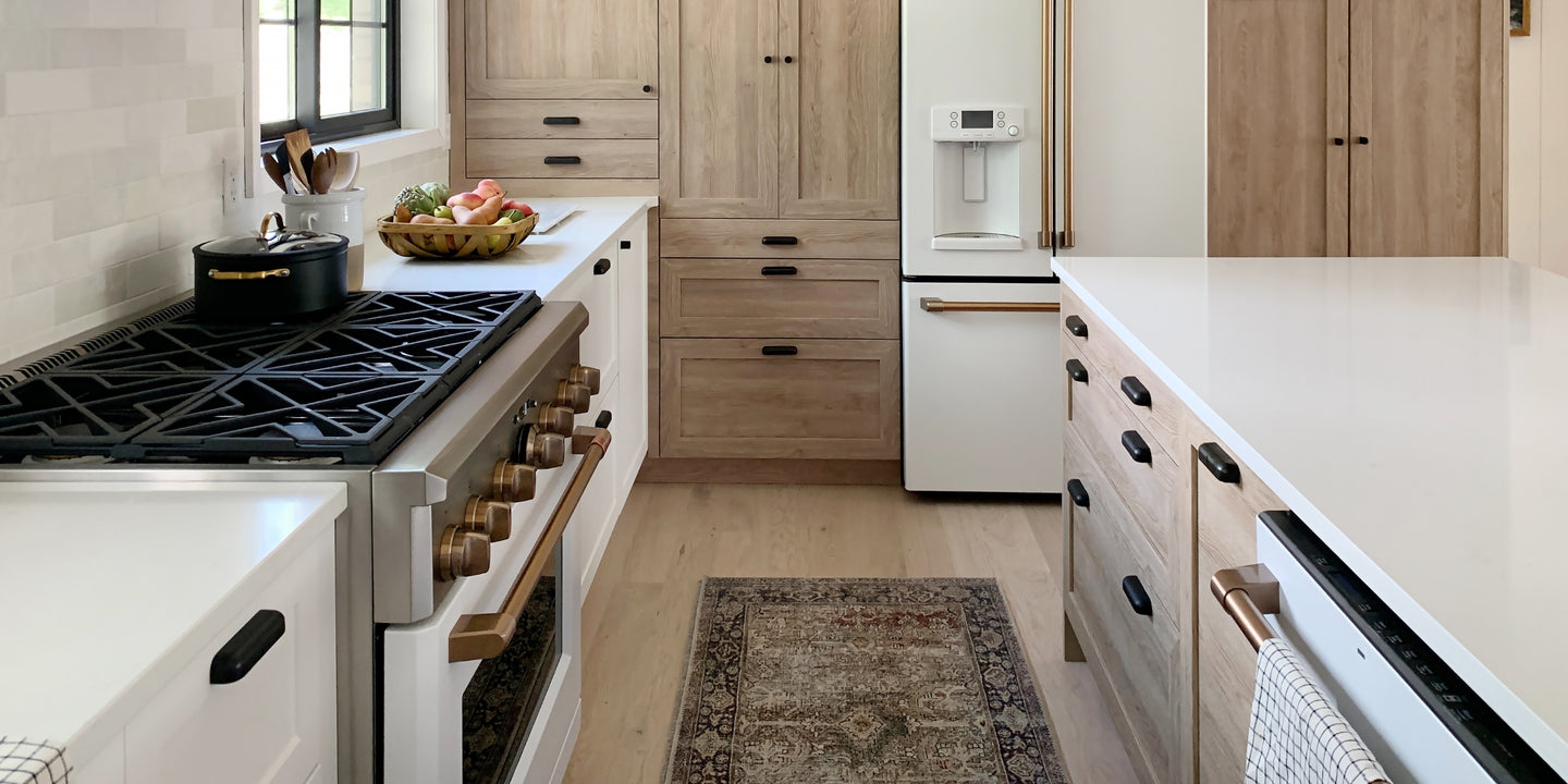 Chris Loves Julia kitchen with white oak flooring by Stuga