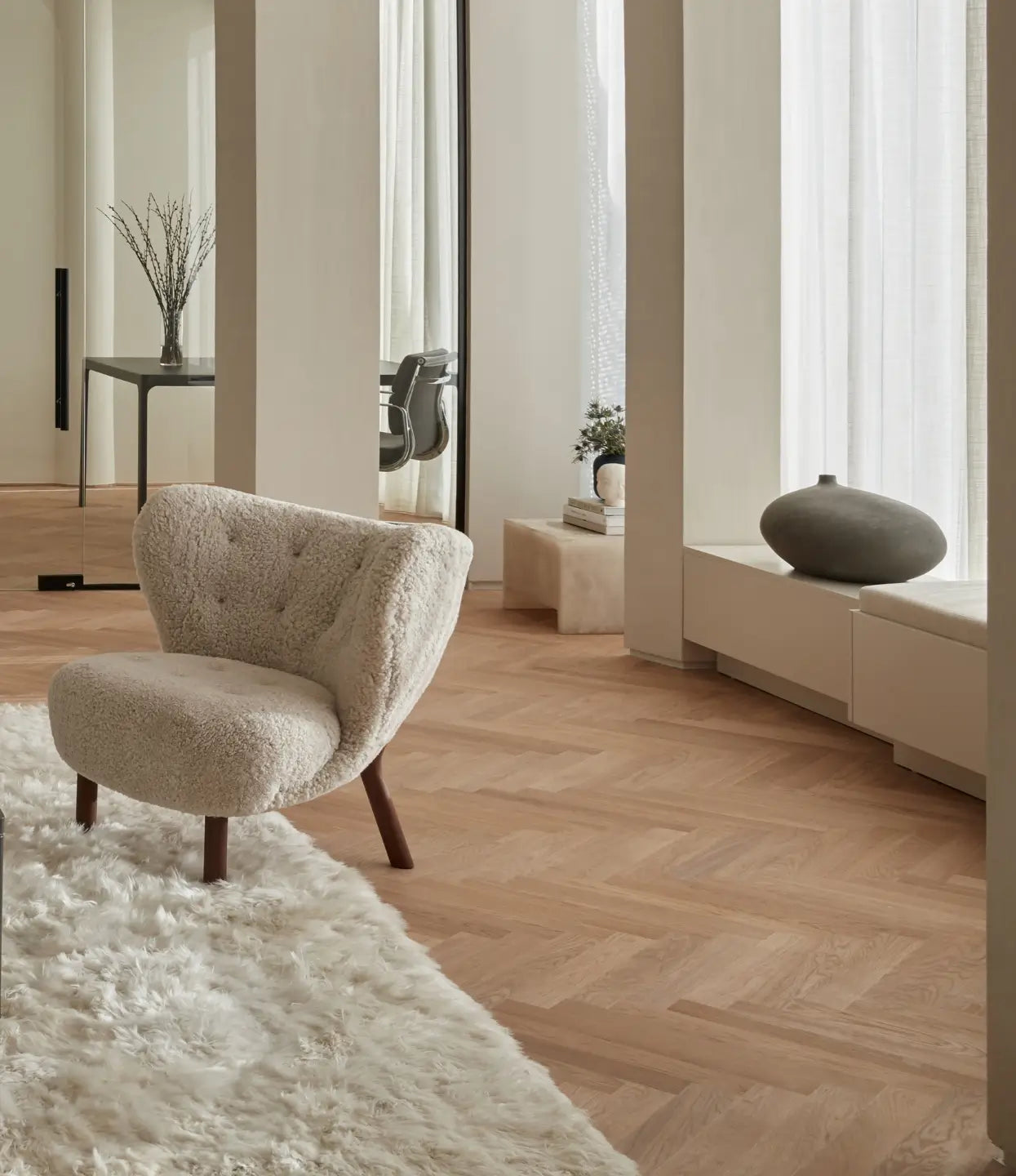 Stuga Sisu herringbone wood flooring in a modern living room