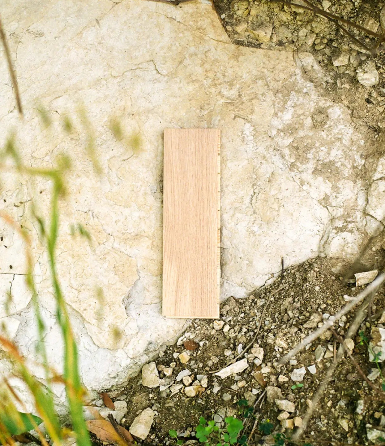 Sisu herringbone wood flooring sample in a limestone outcropping