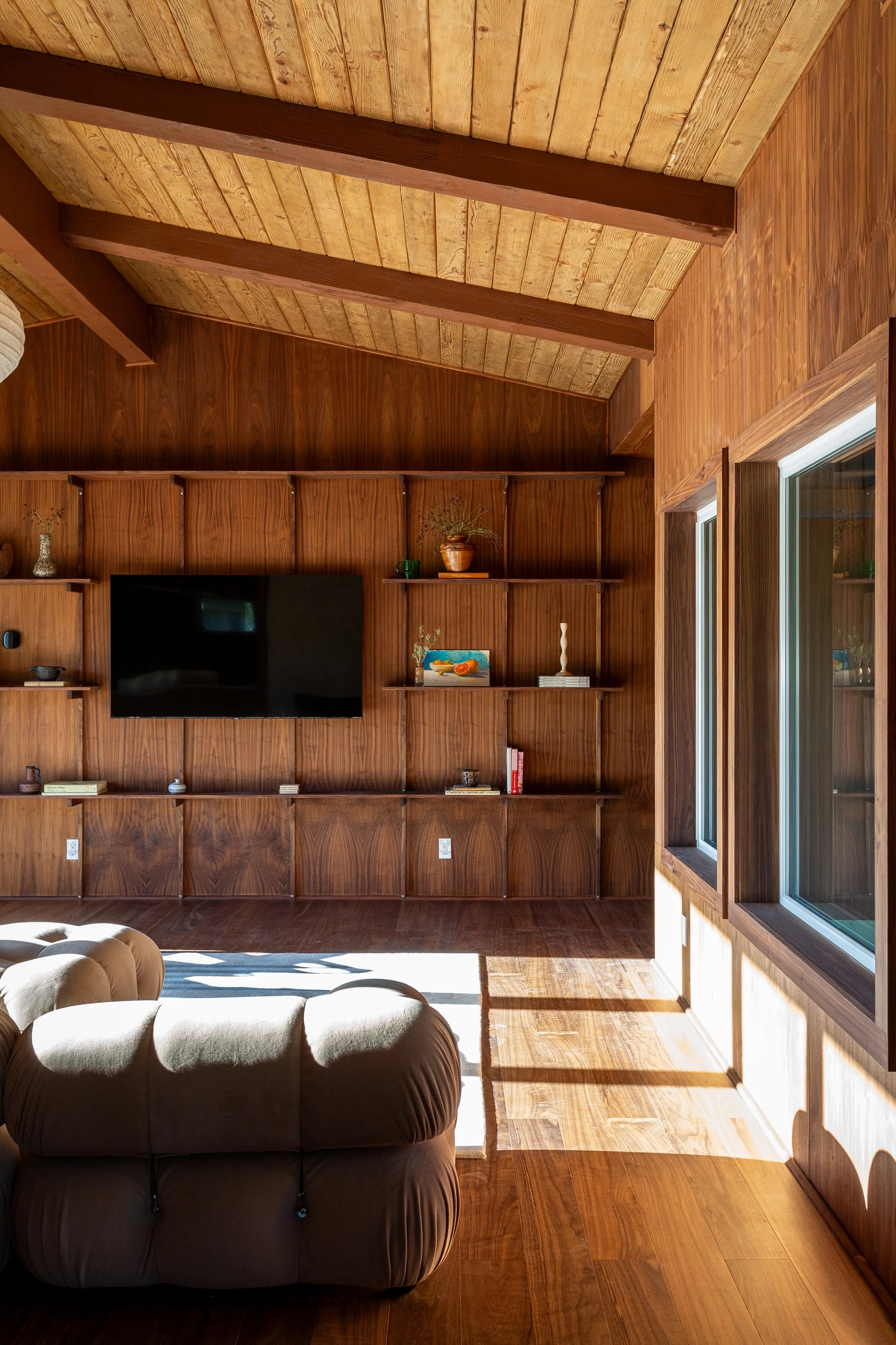 midcentury home with walnut flooring and natural light