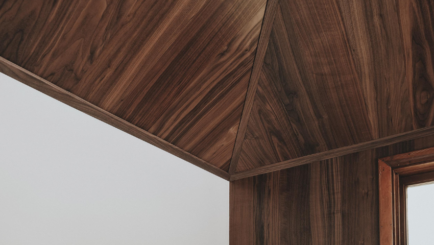 Walnut flooring on walls and ceiling