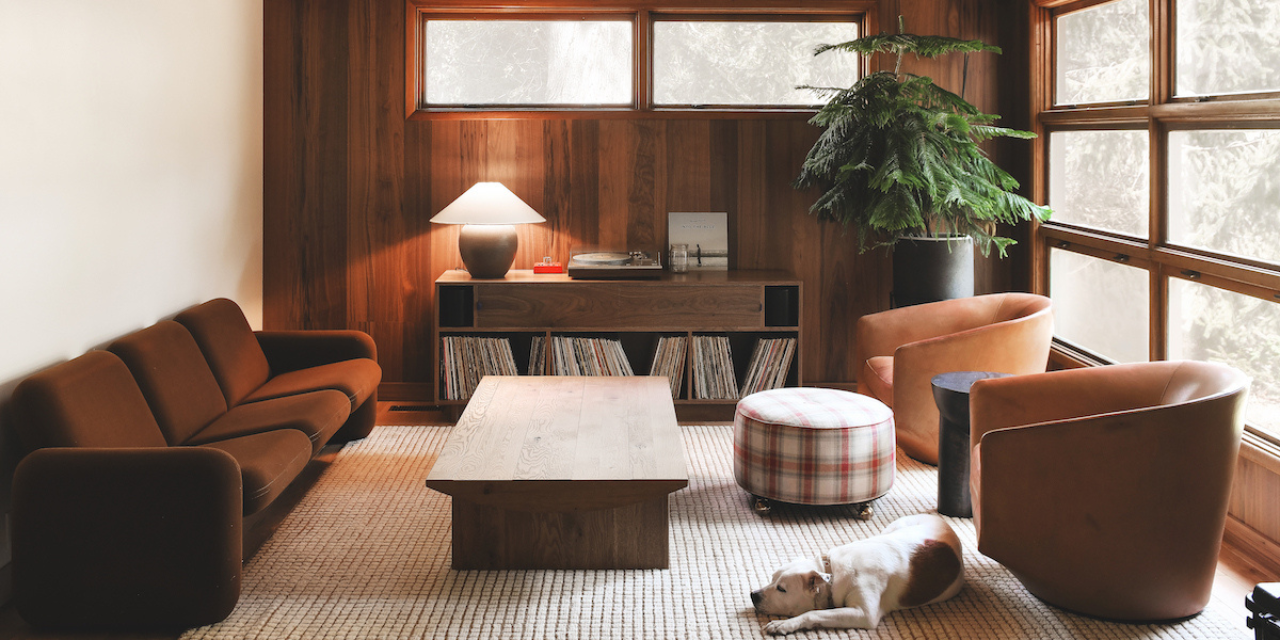 A midcentury living room with brown furniture and walnut flooring on the ceiling