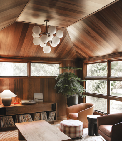 Modern living room with walnut flooring on the walls and ceiling