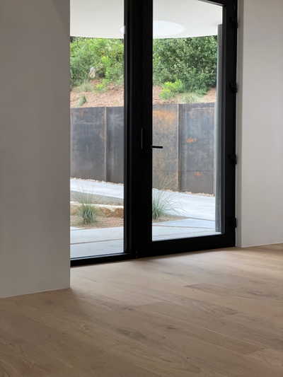 Greta modern white oak flooring by Stuga in an entryway foyer area