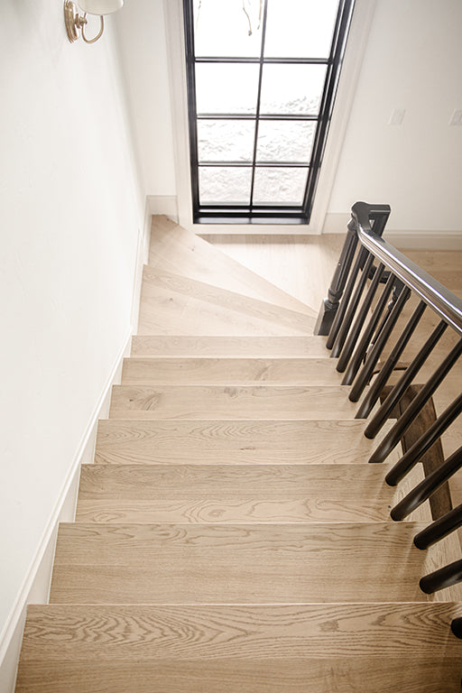 wide plank staircase solution by stuga hardwood flooring for seemless transition