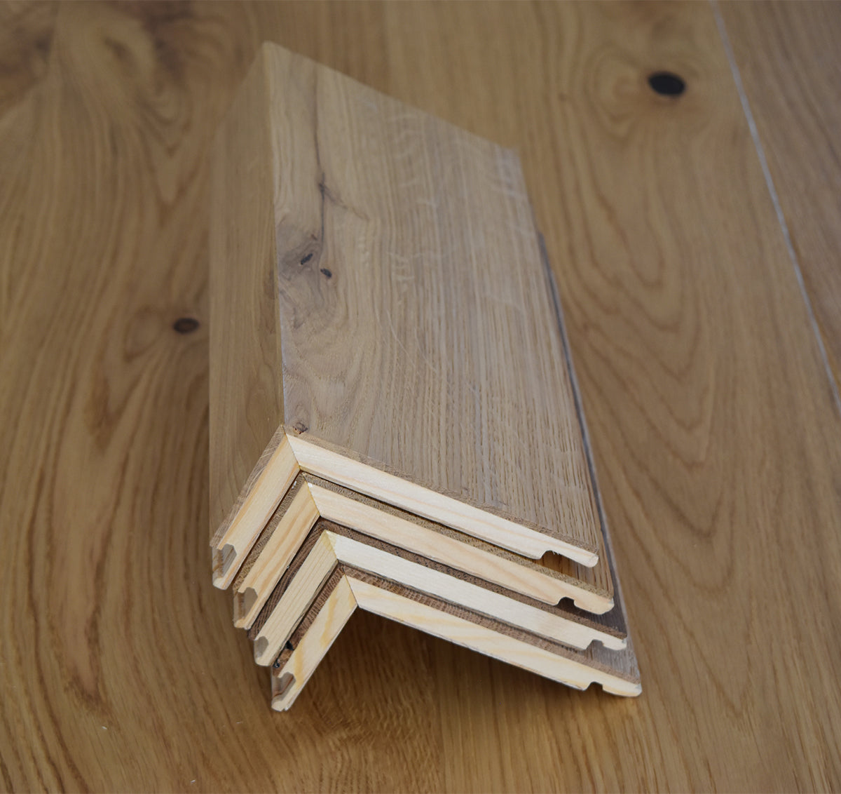 Flush stair nosings made of white oak wood 