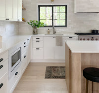 White oak engineered flooring in a modern kitchen with wood cabinets