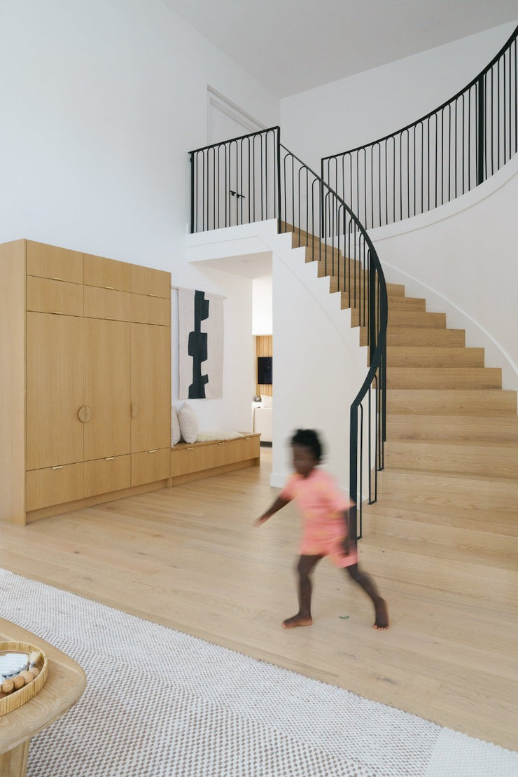 Beautiful staircase solution featuring Stuga Fika engineered hardwood flooring