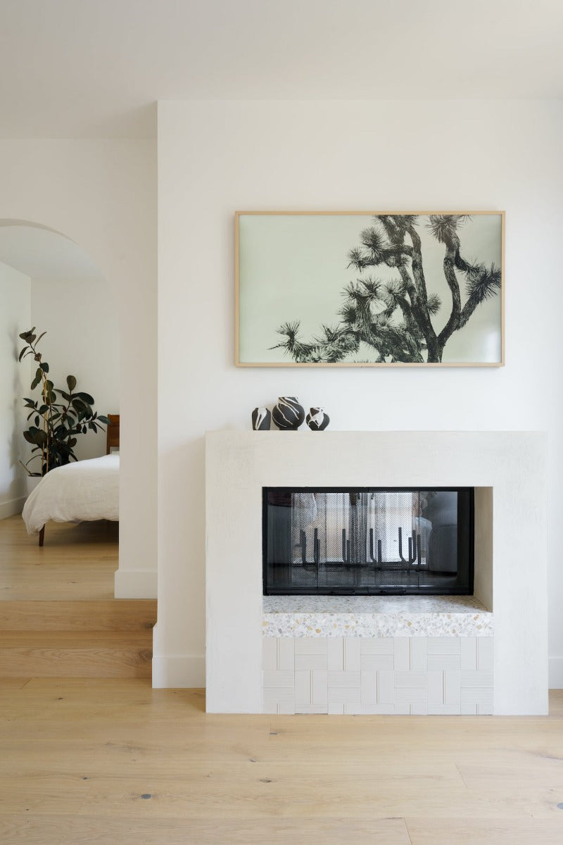 White plaster fireplace with Fika white oak flooring by Stuga