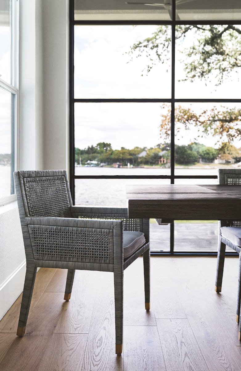 Grey chair sitting near a window. Home inspiration featuring Stuga Greta white oak flooring