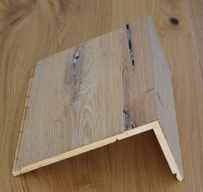 Stuga flush stair nosing side profile locked into tread flooring