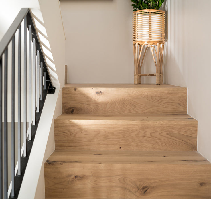 Flush stair nosing on modern wood staircase