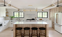 Kitchen with wood island and Moonlight hardwood flooring by Stuga