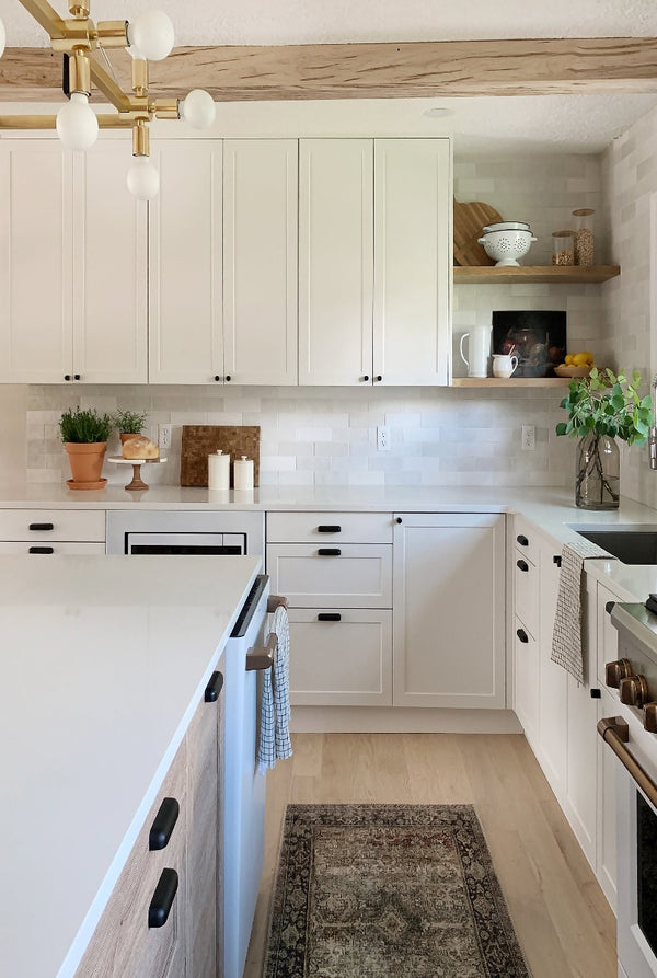 Kitchen renovation with white oak engineered flooring and white cabinets featuring Moonlight by Stuga
